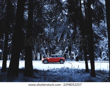 The car trip in the snow forest. Mini Cooper Red Car. Front view of red Mini Cooper S parked on the road. Mini Cooper in accelerating on highway. View of a BMW Mini Cooper, 2007 model, classic car Stock photo © 