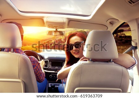 Similar – Two young women resting sitting inside of car