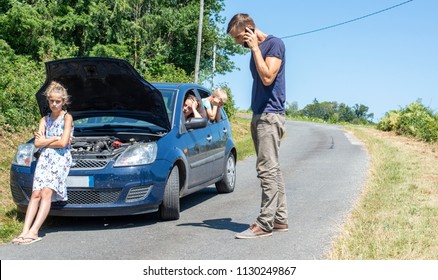 Car Trouble. Man Calling Road Service On Holiday With Broken Car On Vacation.