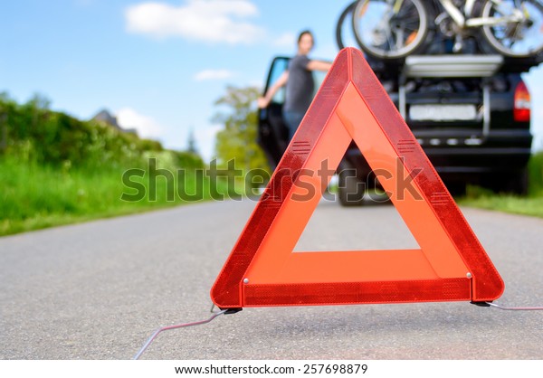Car\
Trouble - woman is waiting for road\
assistance