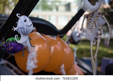 A Car Trunk Decorated For Halloween Trick Or Treat Game