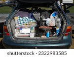 Car trunk ful of equipment for a camping road trip in New Zealand