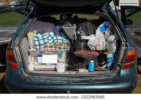Car trunk ful of equipment for a camping road trip in New Zealand