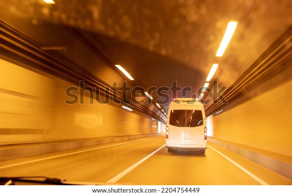 Car in the tunnel in\
motion. Background