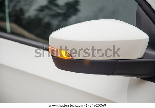 Car Turn Signal Light. Light indicator\
of turn of the car on a rear-view\
mirror
