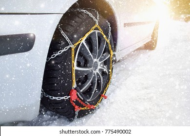 Car with tyre chains in winter
