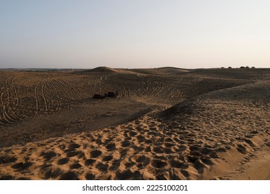 Car Tyre Marks On Sand Dunes Of Thar Desert, Rajasthan, India. Tourists Arrive On Cars To Watch Sun Rise At Desert , A Very Popular Activity Amongst Travellers.