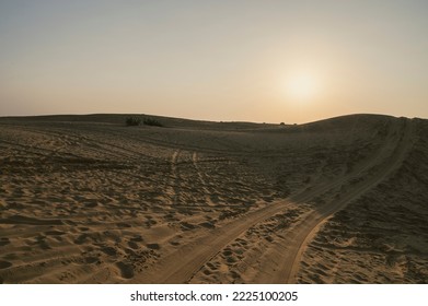 Car Tyre Marks On Sand Dunes Of Thar Desert, Rajasthan, India. Tourists Arrive On Cars To Watch Sun Rise At Desert , A Very Popular Activity Amongst Travellers.