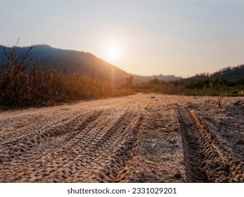 Car tyre track on sand Off road drive Mountain Landscape blur background - Shutterstock ID 2331029201