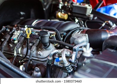 car under hood close up, view on modern engine, turbo, tubes, wires, pipes, Engine Oil Level Indicator Dipstick, mechanical and electrical other parts