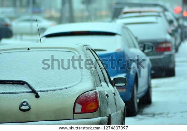 Car under the snow in the\
city