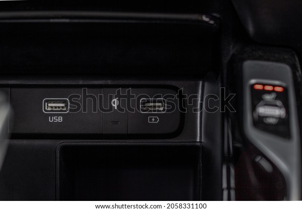 Car USB slots. 12 Voltage outlet. Wireless\
charger indicator.