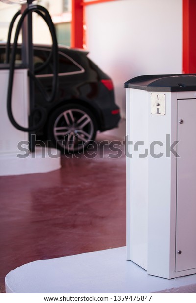 Car vacuum\
cleaner placed in a gas\
station.
