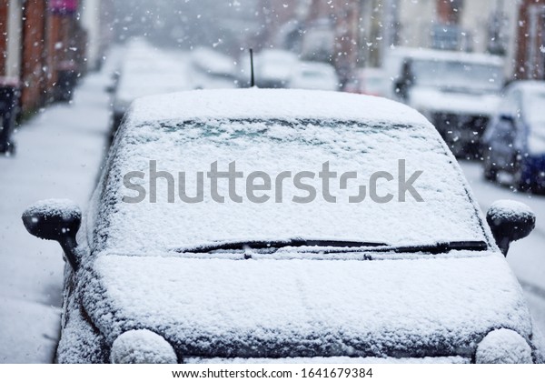 Car Vehicle\
Windscreen covered in Snow.