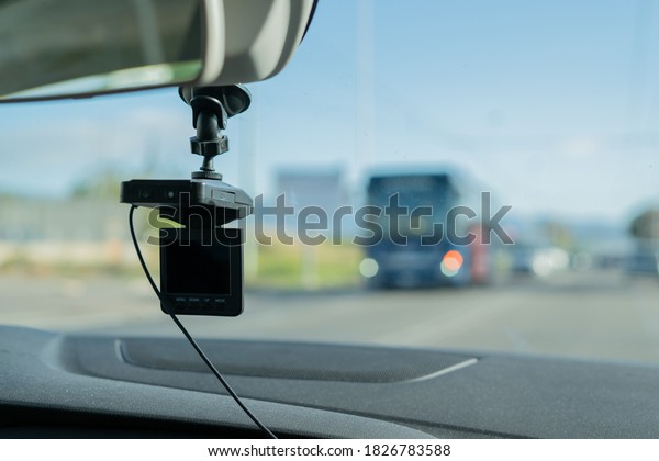 Car video camera (dash cam) inside\
of car on highway with blurred background of highway road, from\
perspective of the driver. Concept of safety camera\
...