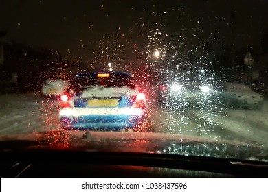 In Car View Of Snow Fall Storm In The UK Causes Traffic Congestion At Night