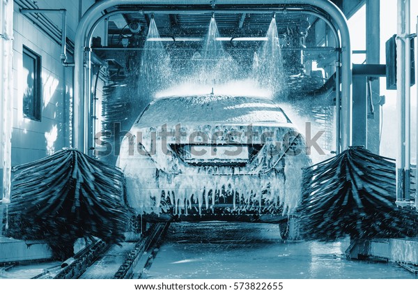 car wash, Automatic car wash in action,\
blue colored, Car concept. Wash car. Technology.\
