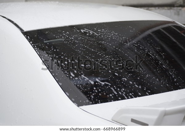 Car wash. Car back\
mirror.