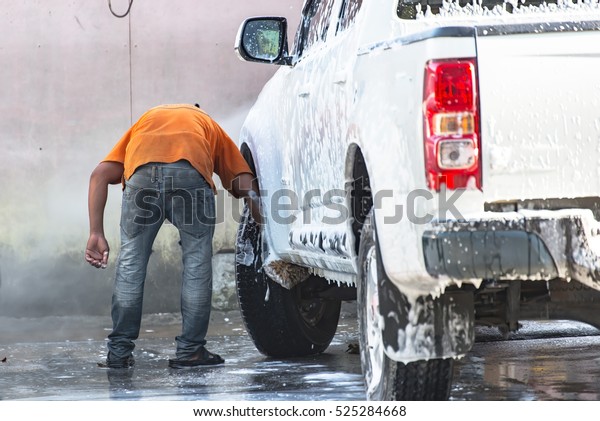 Car Wash by hand using foam\
preparation for polishing cars in focus at the Carwash\
choice.