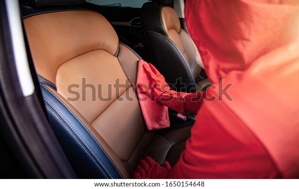 Car wash
cleaning concepts . Auto service staff cleaning car with microfiber
cloth in Interior car console
