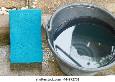 Car Wash Equipment, Bucket Of Water, Sponge. Image  Selective Focus At Sponge