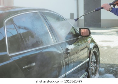 Car Wash High-pressure Apparatus Of Water. Black Car On A Handwash Self-service.