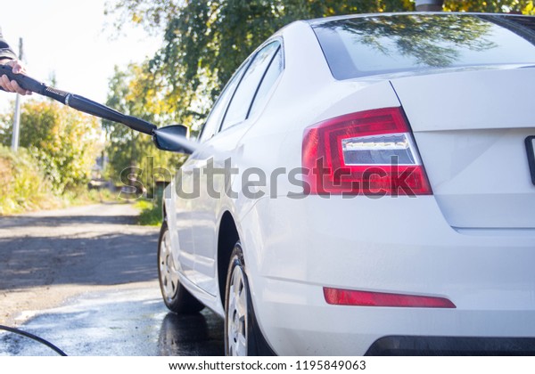 Car wash. car\
wash. Man washes the car.\
Foam