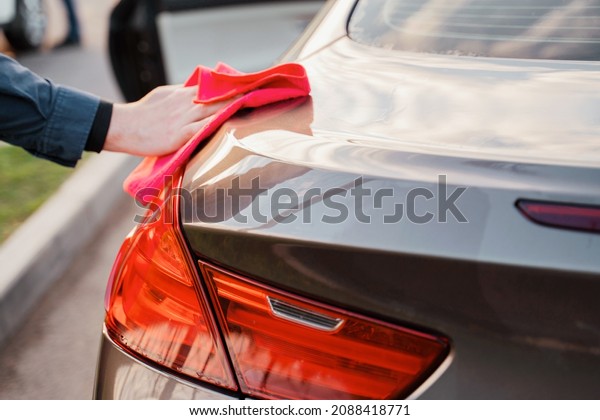 Car wash shine at the\
self-service station. Application of special cleaning agents on the\
car body.