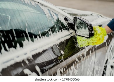 Car Wash With Special Cleaning Products Side Mirror. Soap Sponge