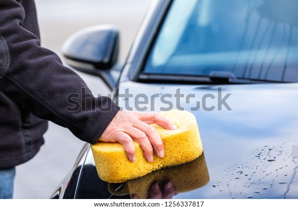 Car wash with a yellow\
soft sponge