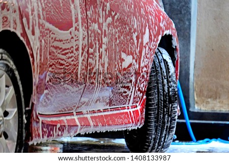 Car washing with soap and high pressure water