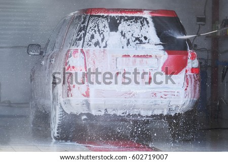 Car in a car washing station