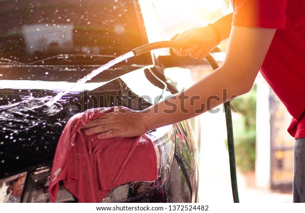 Car
washing,Cleaning Car Using sponge for washing
car
