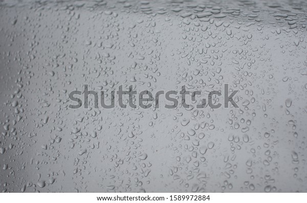 car with water drops after\
snow