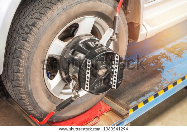 Car wheel\
alignment at service station\
center