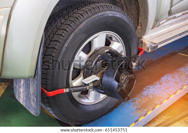 Car wheel\
alignment at service station\
center