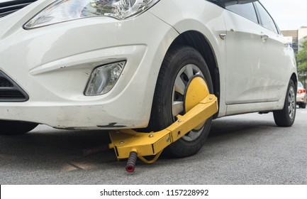 Car Wheel Blocked By Wheel Lock Because Illegal Parking Violation