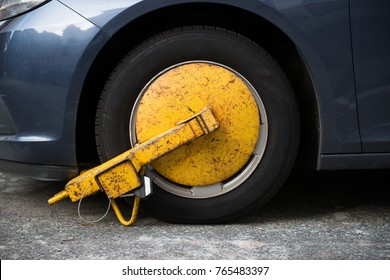 Car Wheel Blocked By Wheel Lock Because Illegal Parking Violation