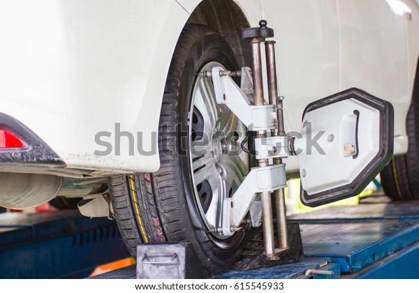 car wheel centering machine adjustment selective\
focus on machine caliper