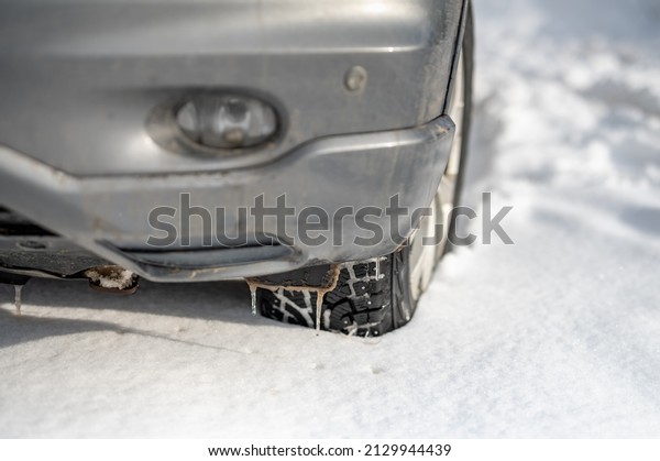 car\
wheel in deep winter snow snowbank wheel\
protector