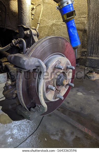 car wheel\
disassembled in auto repair closeup\
photo
