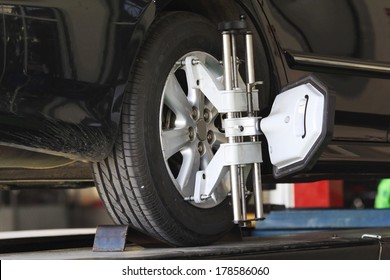 Car Tire Alignment Cost, Car Wheel Fixed With Computerized Wheel Alignment Machine Clamp, Car Tire Alignment Cost