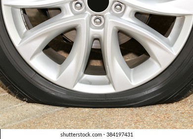 car wheel flat tire on the road