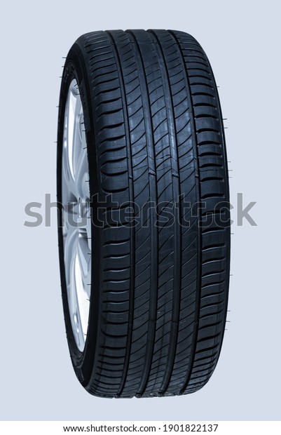 Car\
wheel isolated on a white background. Blue\
toned