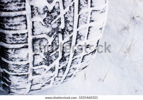 car wheel leaves a mark\
on the snow