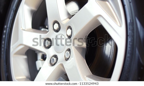Car wheel on a car close-up. Stock. Wheel tuning\
disk. Car wheel close-up