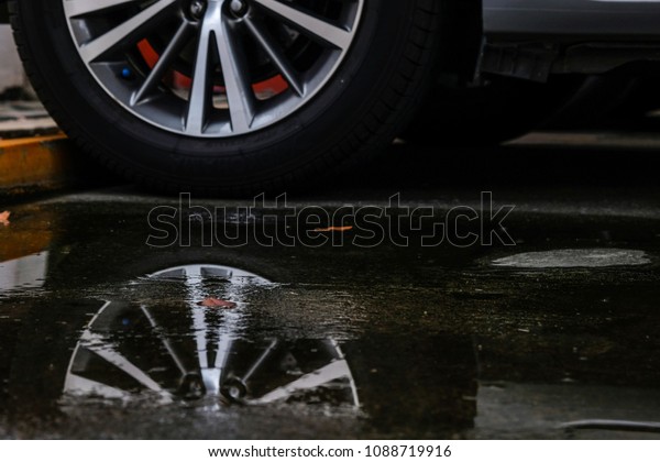 Car\
wheel pedal on water rainy season Water on the\
street