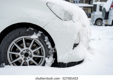 Car Wheel with snow frost,Dangerous and High risk for slippery,Drive carefully,Bad weather.