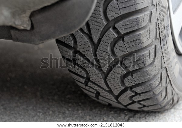 Car wheel with winter tyre close up. Car repair\
and service