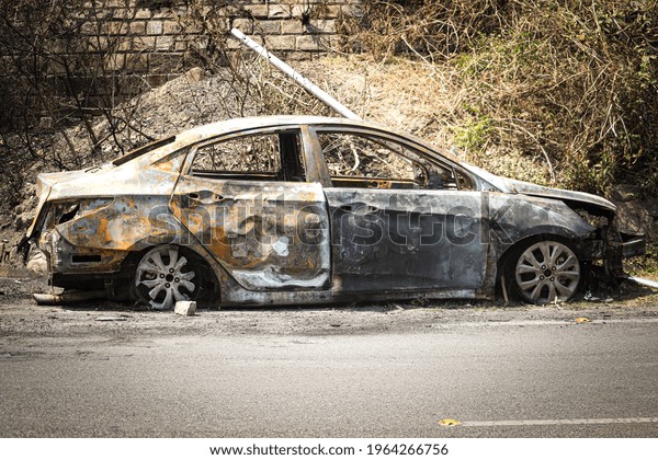 car which was abandoned after fire. Old and rusty\
abandoned car